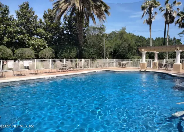 a view of a swimming pool with a patio