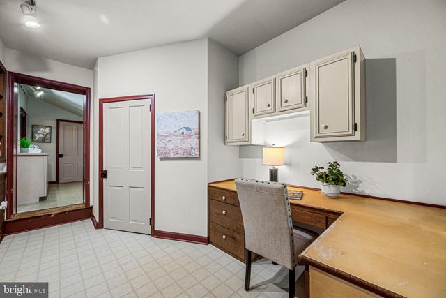 a workspace with furniture and window