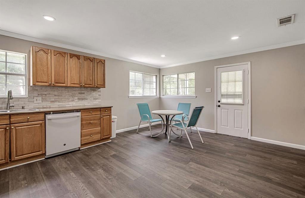 3952 J J Rendon Road Burleson, TX 76028 - Photo 8 of 25 Beautiful flooring and back splash. Plenty of room for a dining in this spacious kitchen.