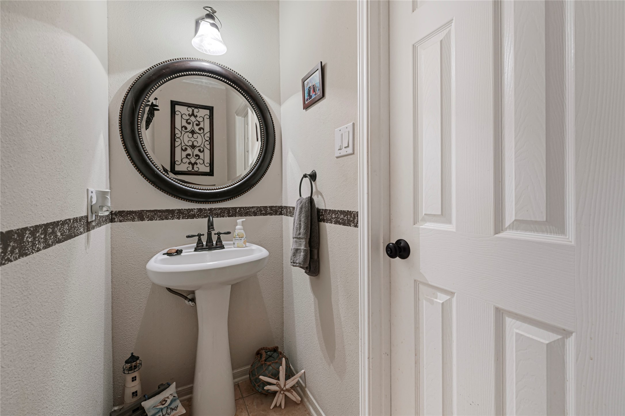 15306 Progress Ridge Way Cypress, TX 77429 - Photo 15 of 37 a bathroom with a sink and a mirror