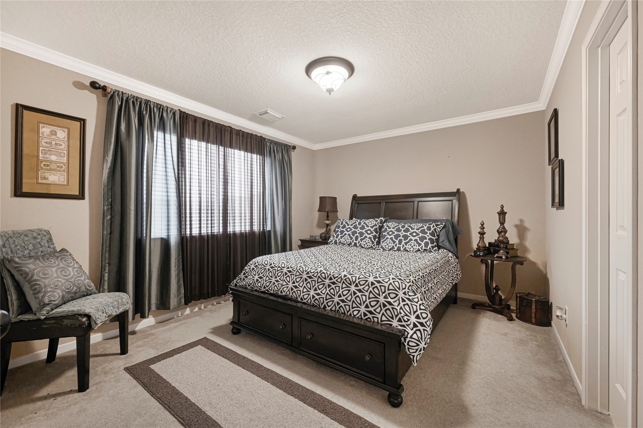 15306 Progress Ridge Way Cypress, TX 77429 - Photo 23 of 37 a bedroom with a bed and a couch