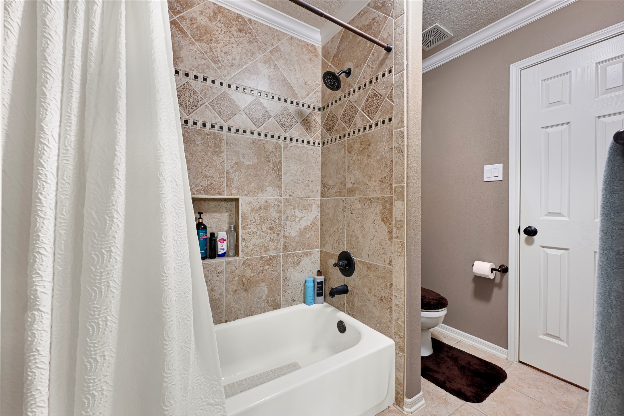 15306 Progress Ridge Way Cypress, TX 77429 - Photo 25 of 37 a bathroom with a bathtub and a shower