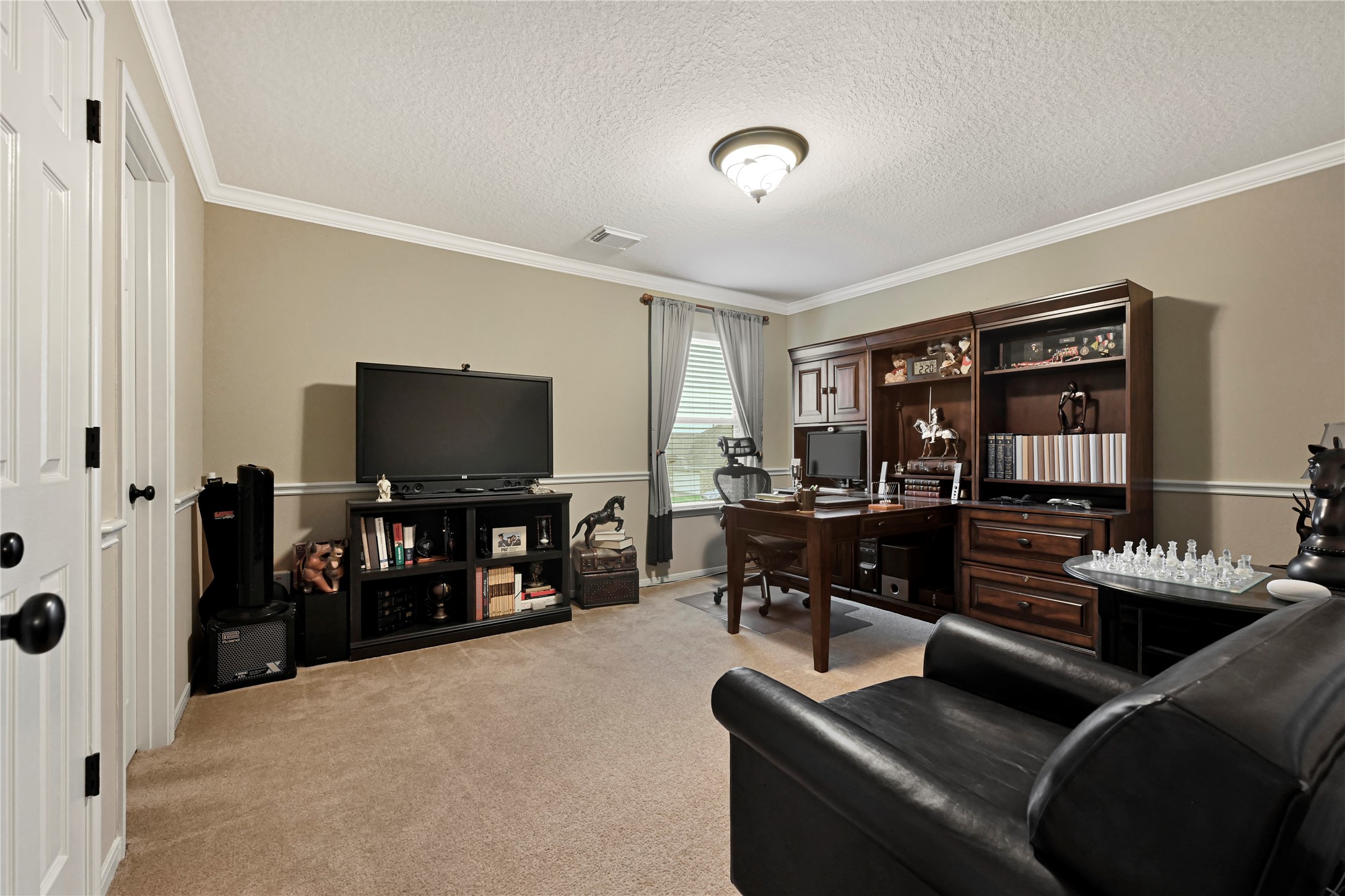 15306 Progress Ridge Way Cypress, TX 77429 - Photo 26 of 37 a living room with furniture and a flat screen tv