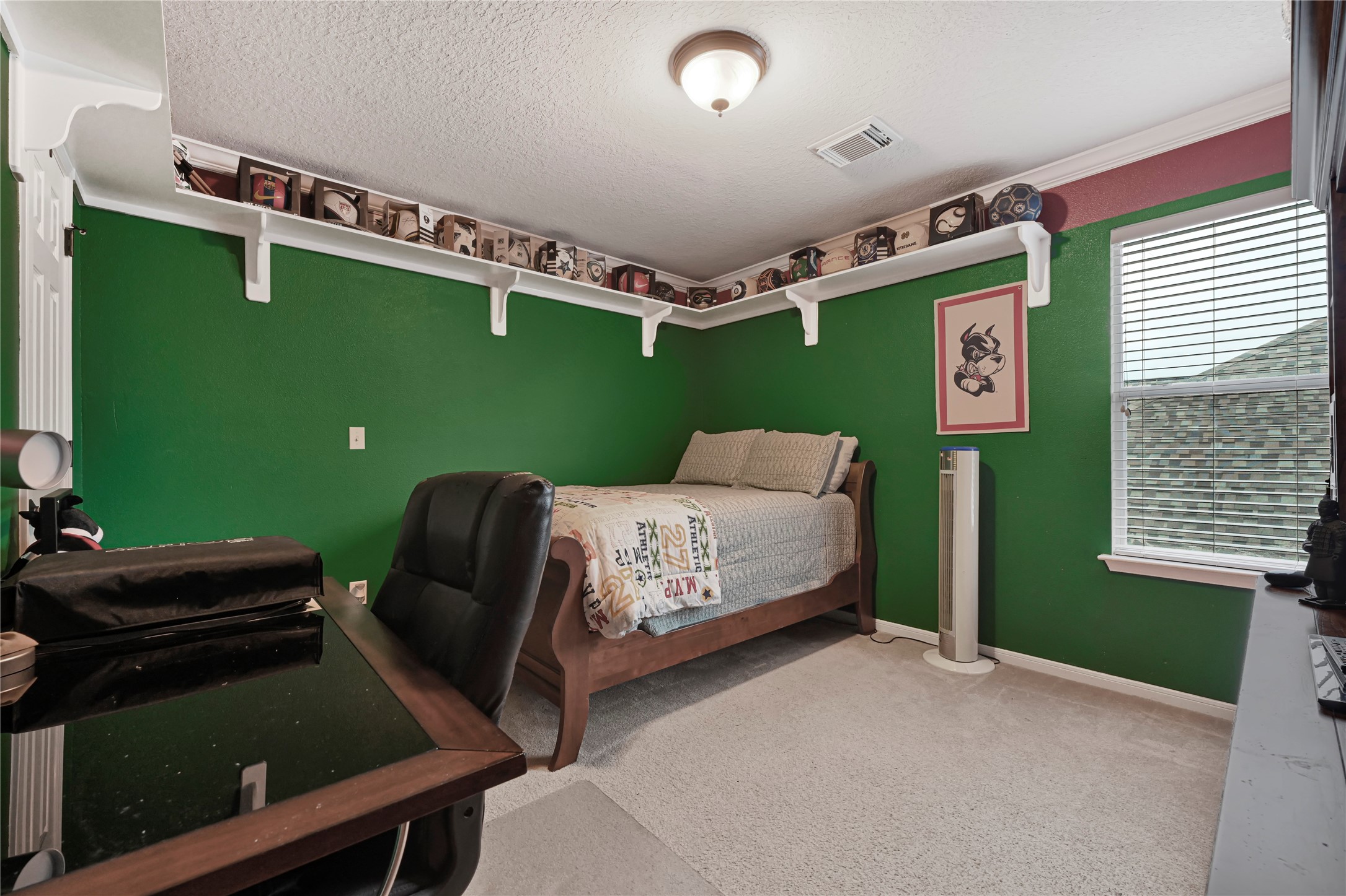 15306 Progress Ridge Way Cypress, TX 77429 - Photo 29 of 37 a bedroom with a bed and windows