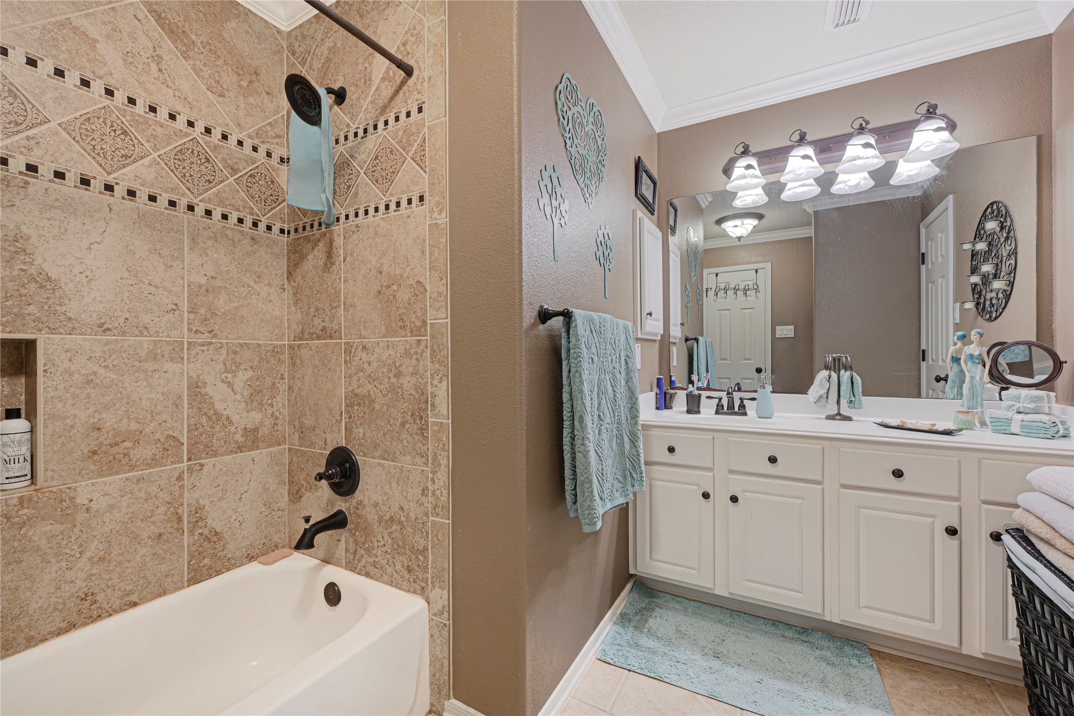 15306 Progress Ridge Way Cypress, TX 77429 - Photo 30 of 37 a bathroom with a tub sink and mirror