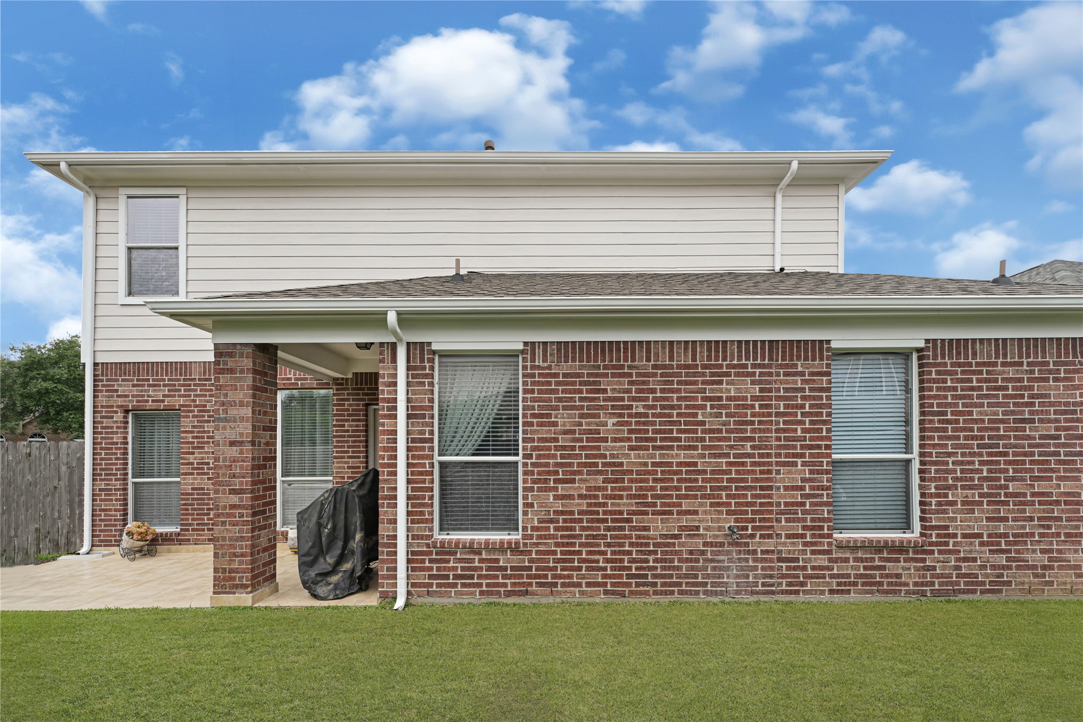 15306 Progress Ridge Way Cypress, TX 77429 - Photo 33 of 37 a front view of a house with a garden