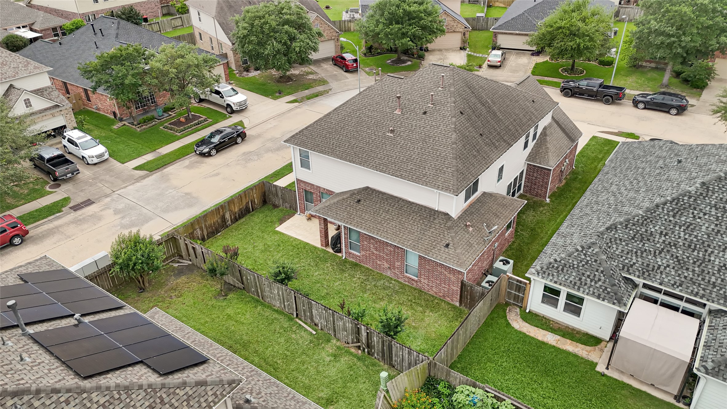 15306 Progress Ridge Way Cypress, TX 77429 - Photo 37 of 37 an aerial view of a house with a garden and trees