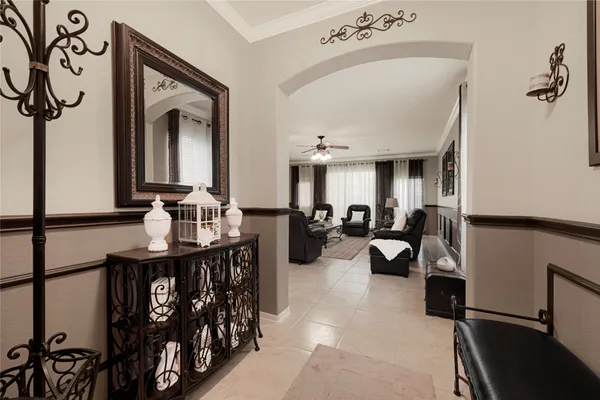 a living room with furniture fireplace and window
