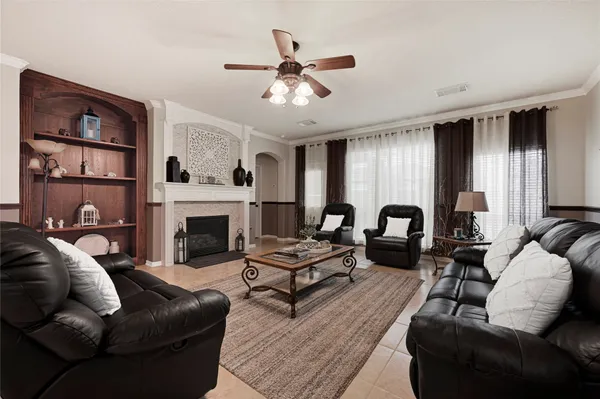 a living room with furniture and a fireplace