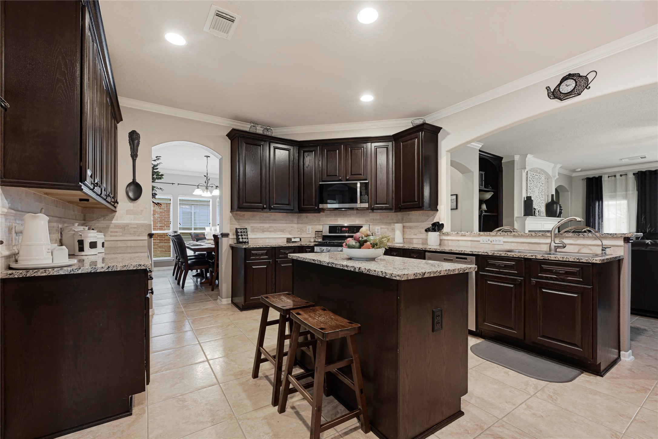 15306 Progress Ridge Way Cypress, TX 77429 - Photo 10 of 37 a kitchen with cabinets a sink and appliances