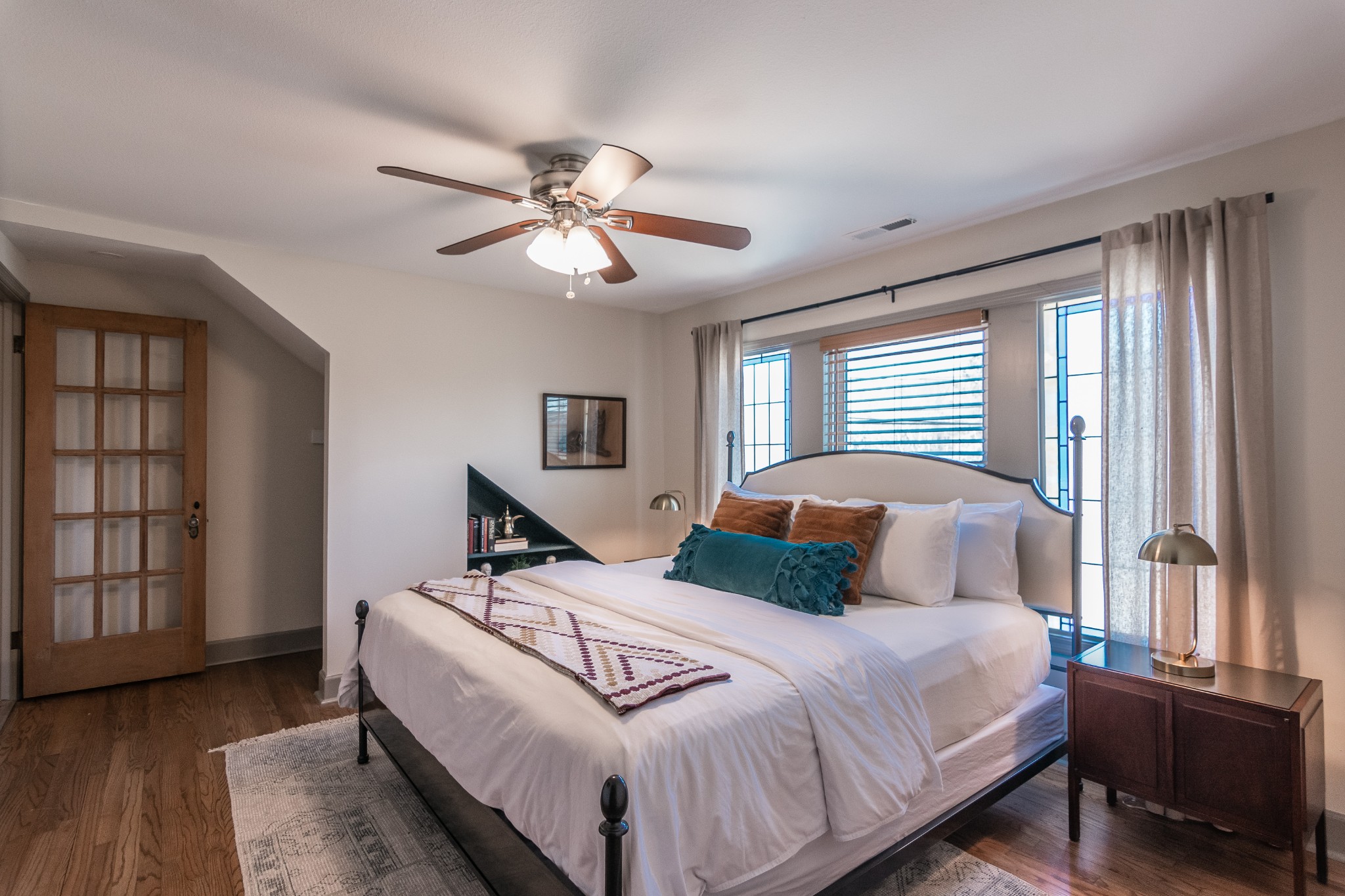 7159 Whites Creek Pike Joelton, TN 37080 - Photo 16 of 24 a bedroom with a large bed and a chandelier