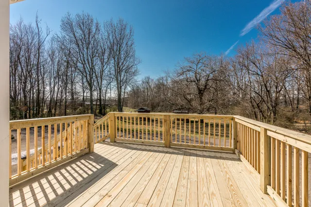 a view of deck with wooden floor and fence