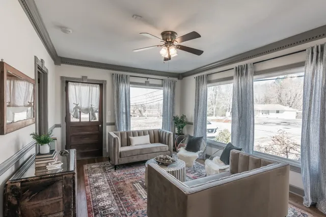 a living room with furniture and a window