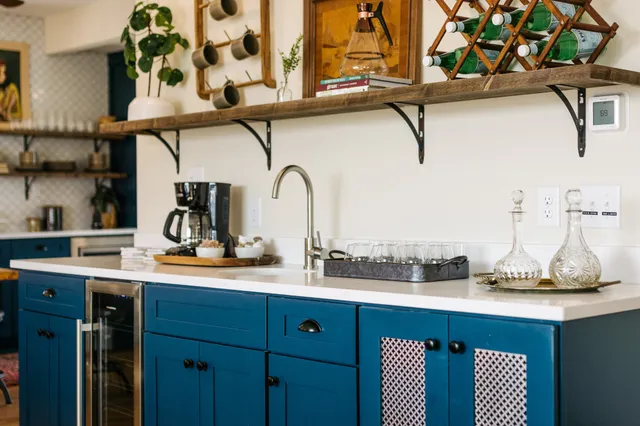 a kitchen with a sink and cabinets