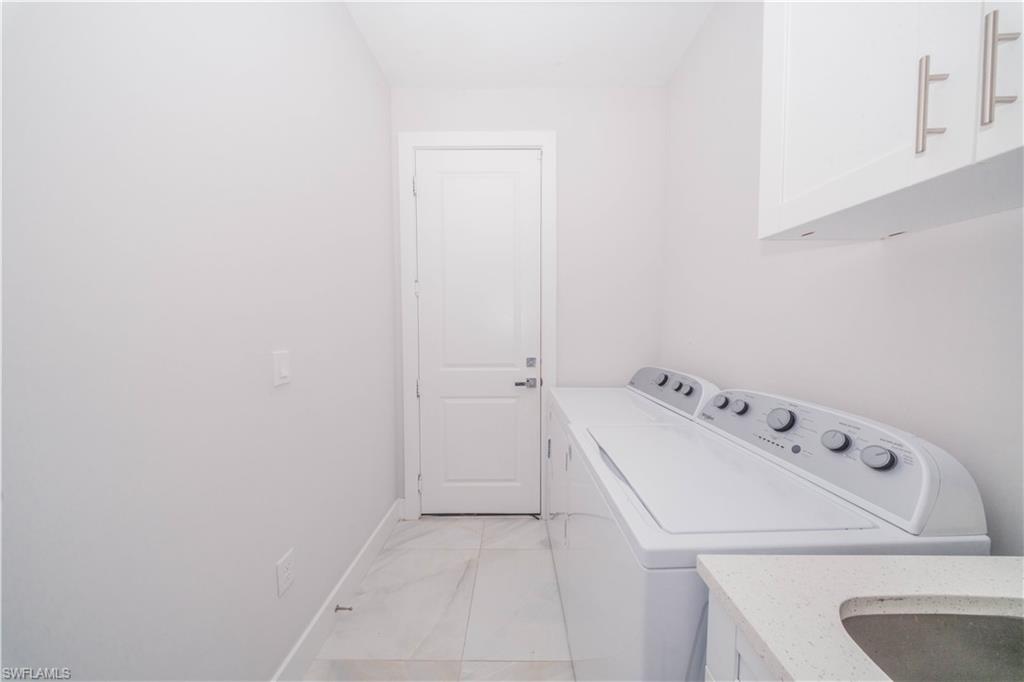 808 37th Avenue Northwest Naples, FL 34120 - Photo 15 of 27 a bathroom with a sink and a tub