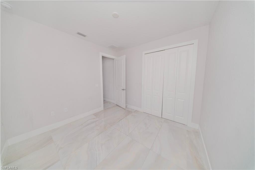 808 37th Avenue Northwest Naples, FL 34120 - Photo 21 of 27 a view of an empty room