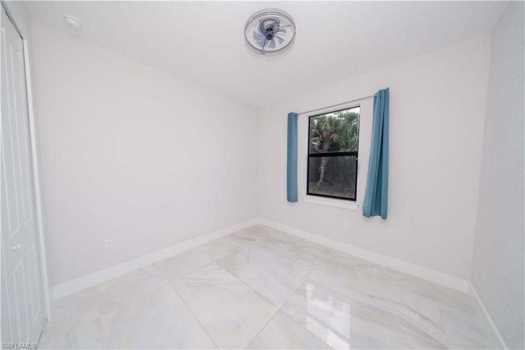 808 37th Avenue Northwest Naples, FL 34120 - Photo 22 of 27 a white wall with a window
