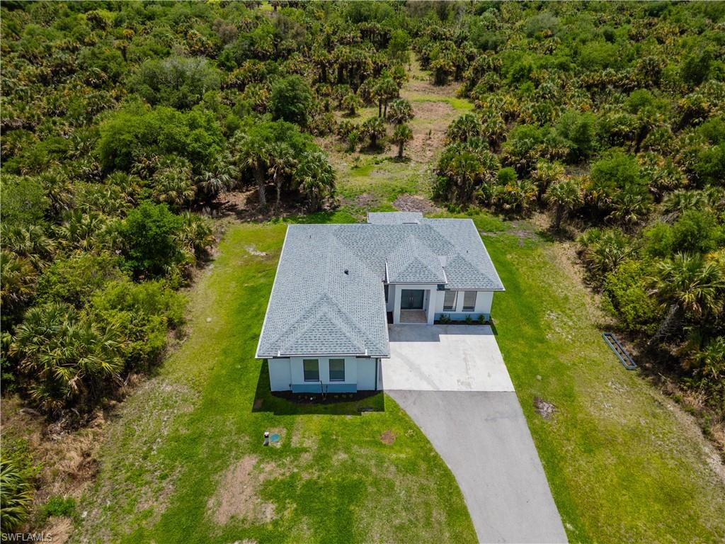 808 37th Avenue Northwest Naples, FL 34120 - Photo 24 of 27 an aerial view of house with yard