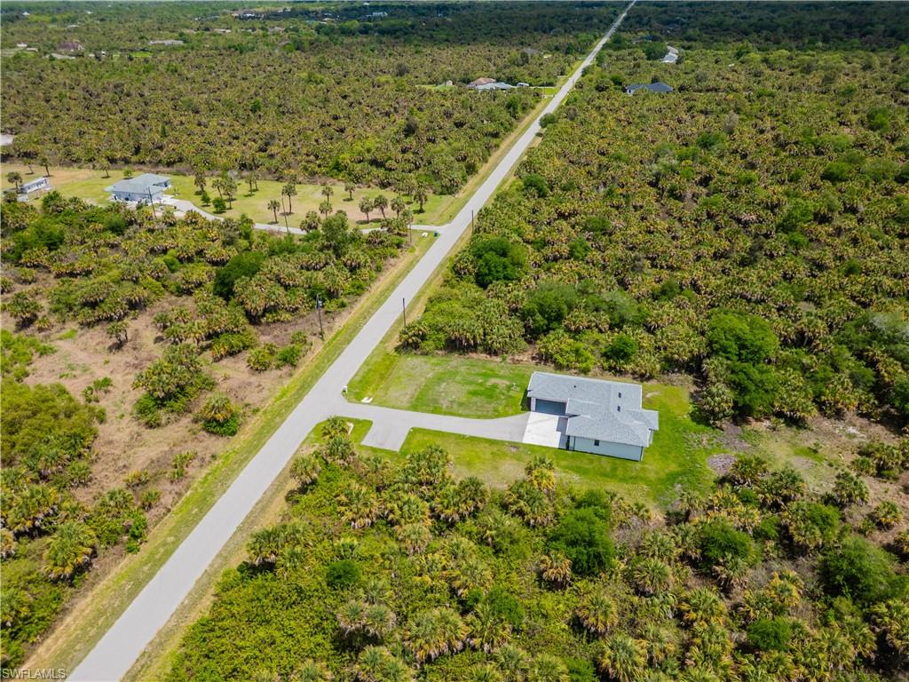 808 37th Avenue Northwest Naples, FL 34120 - Photo 26 of 27 a view of a yard with a wooden wall