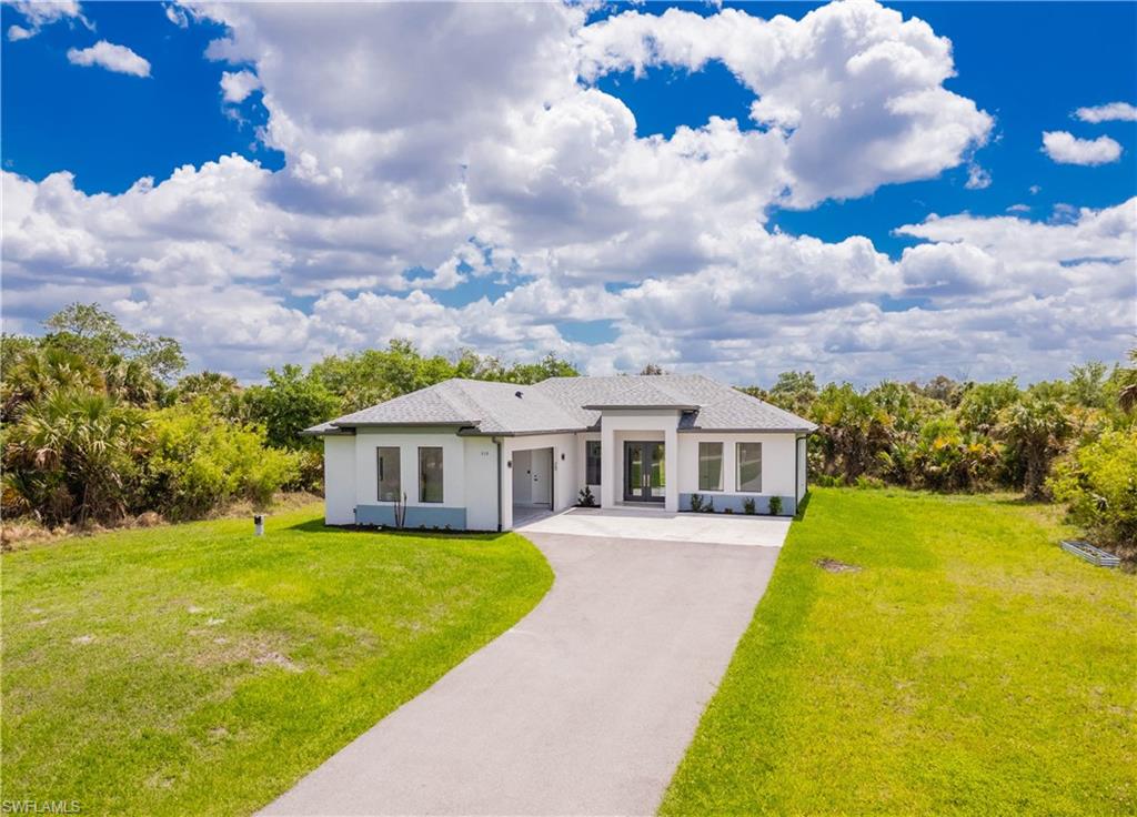 808 37th Avenue Northwest Naples, FL 34120 - Photo 4 of 27 a view of a house with a big yard