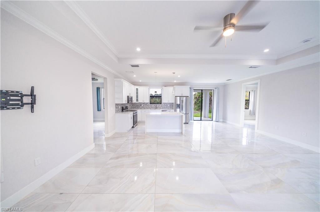 808 37th Avenue Northwest Naples, FL 34120 - Photo 9 of 27 a view of a kitchen with furniture and a kitchen view