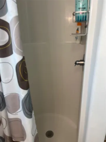 a stove top oven sitting inside of a kitchen