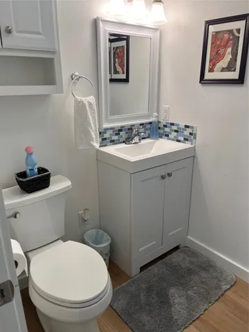 a bathroom with a toilet and a sink