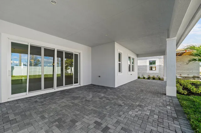 a kitchen with kitchen island a sink stainless steel appliances and cabinets