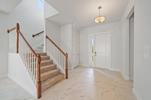 a large kitchen with stainless steel appliances granite countertop a stove and a sink