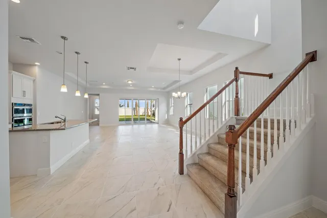 a kitchen with granite countertop cabinets and steel stainless steel appliances