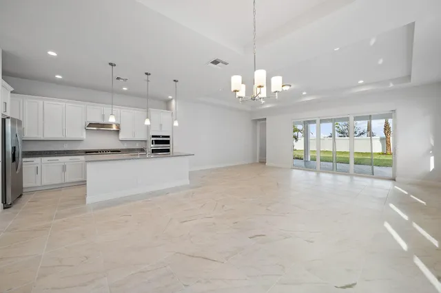 a view of an empty room and a window