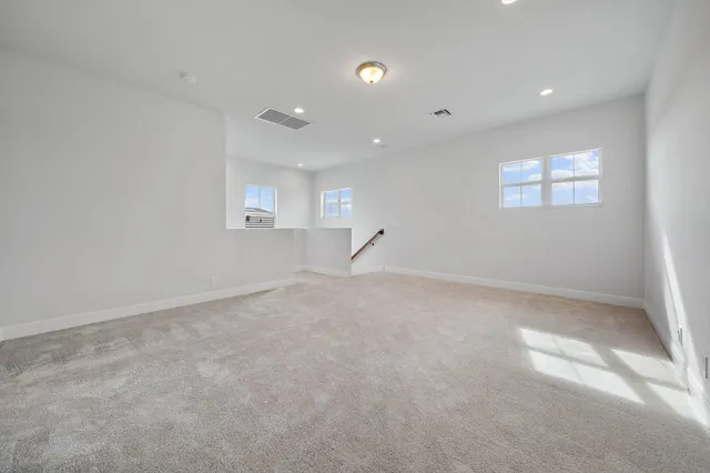 a view of a swimming pool with outdoor seating