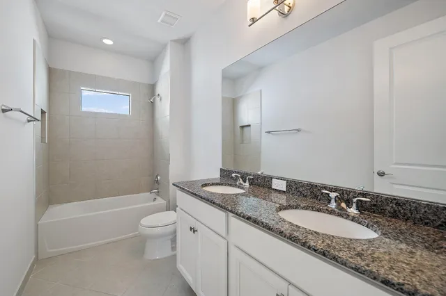 a view of building with river in front of it