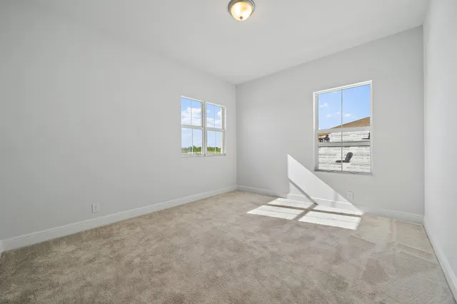 a outdoor living space with patio furniture and a large window