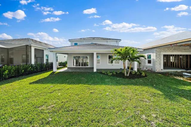 a view of staircase and kitchen view with wooden floor