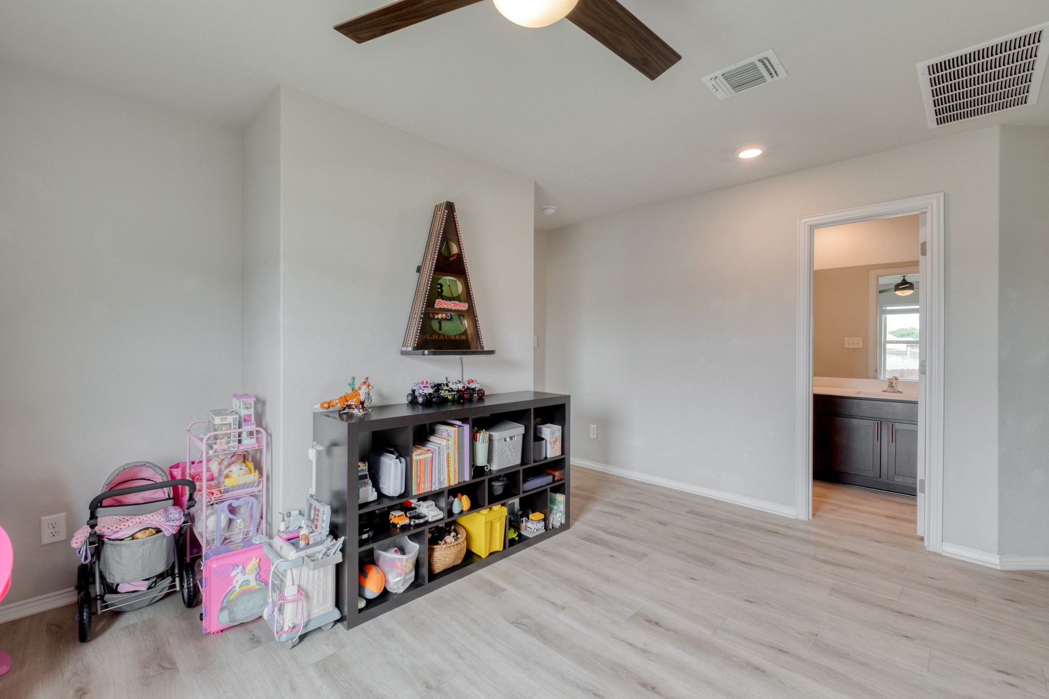 1000 Bright Star Cove Georgetown, TX 78628 - Photo 26 of 40 a room with toys and wooden floor