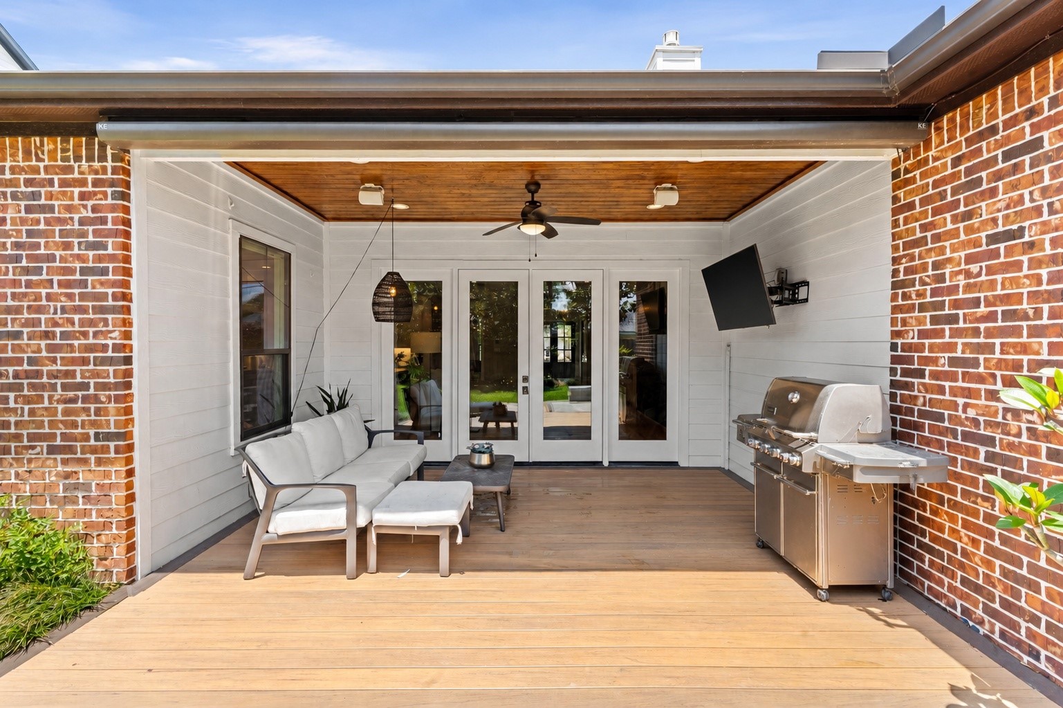 1013 Martin Street Houston, TX 77018 - Photo 40 of 46 Spacious covered outdoor living area seamlessly connected to the home through French doors creating the perfect setting for entertaining, dining, & everyday enjoyment.