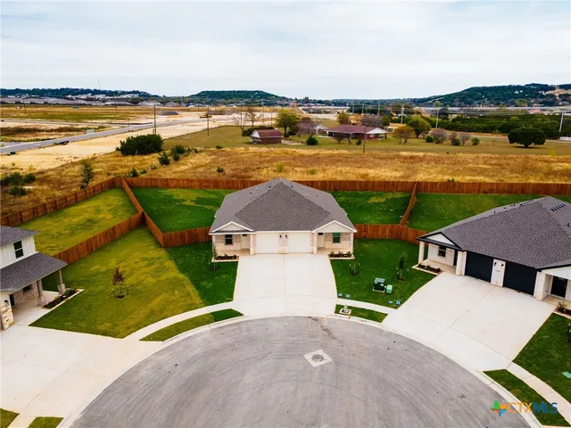 an aerial view of a house with a ocean view