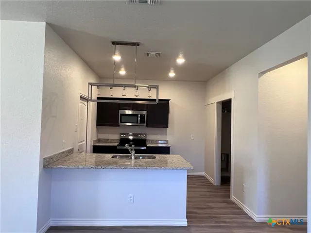 a view of dining room with wooden floor