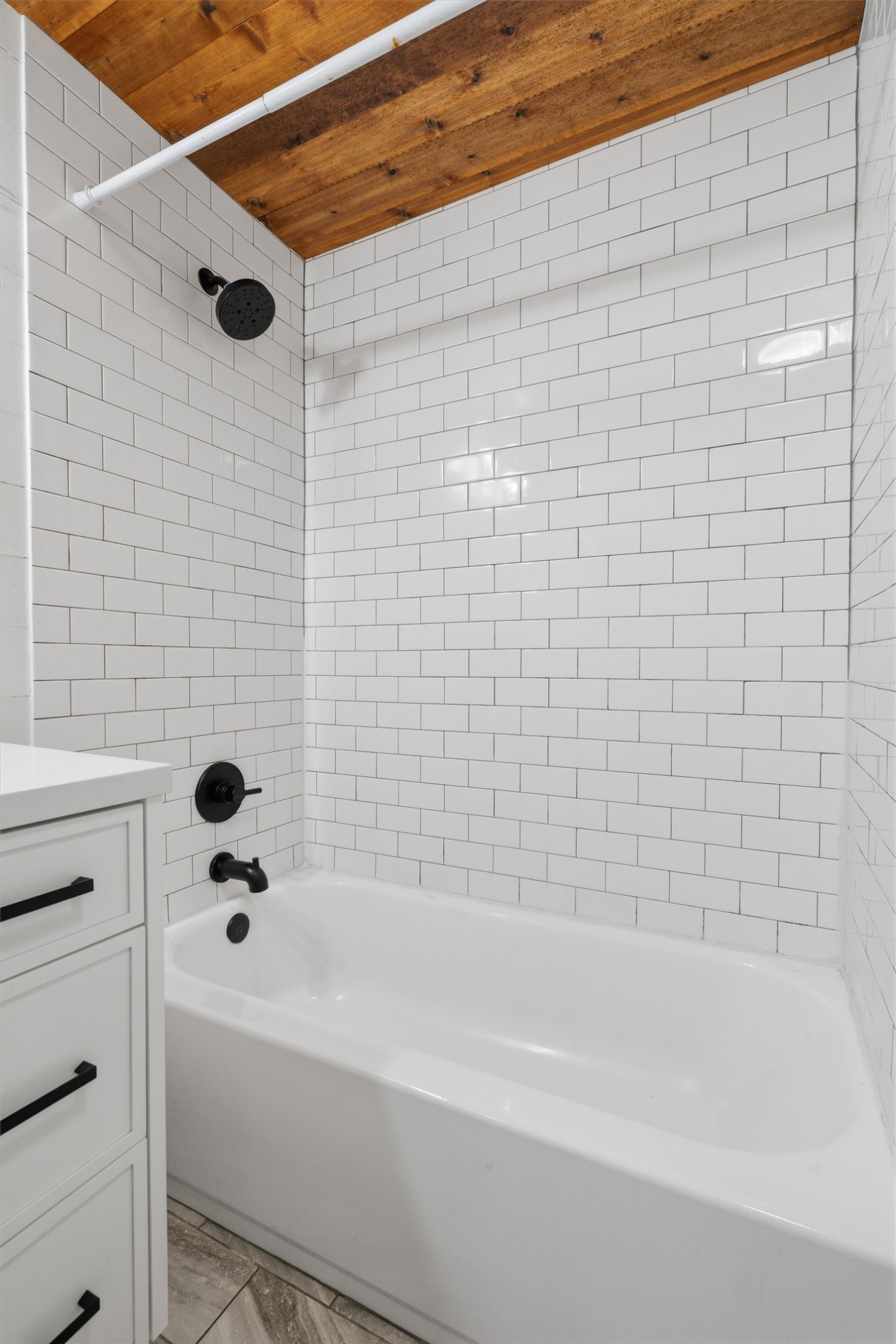2204 Santa Rita Street Austin, TX 78702 - Photo 15 of 23 Crisp subway tile contrasts beautifully with a warm natural wood plank ceiling.