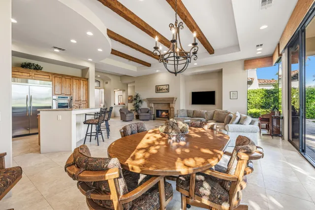 a living room with large window and a flat screen tv