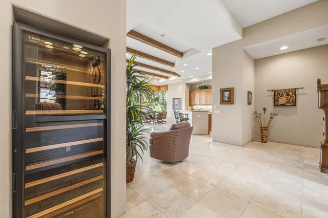 a kitchen with a sink and a stove next to a window