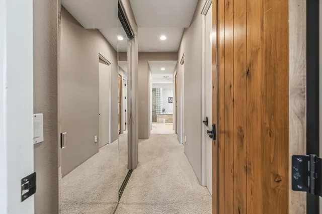 a bedroom with a large bed and a tv