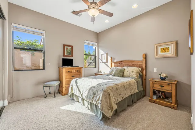 a bathroom with a double vanity sink mirror and shower