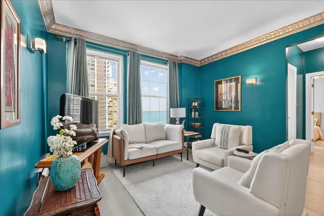 a living room with furniture and a large window