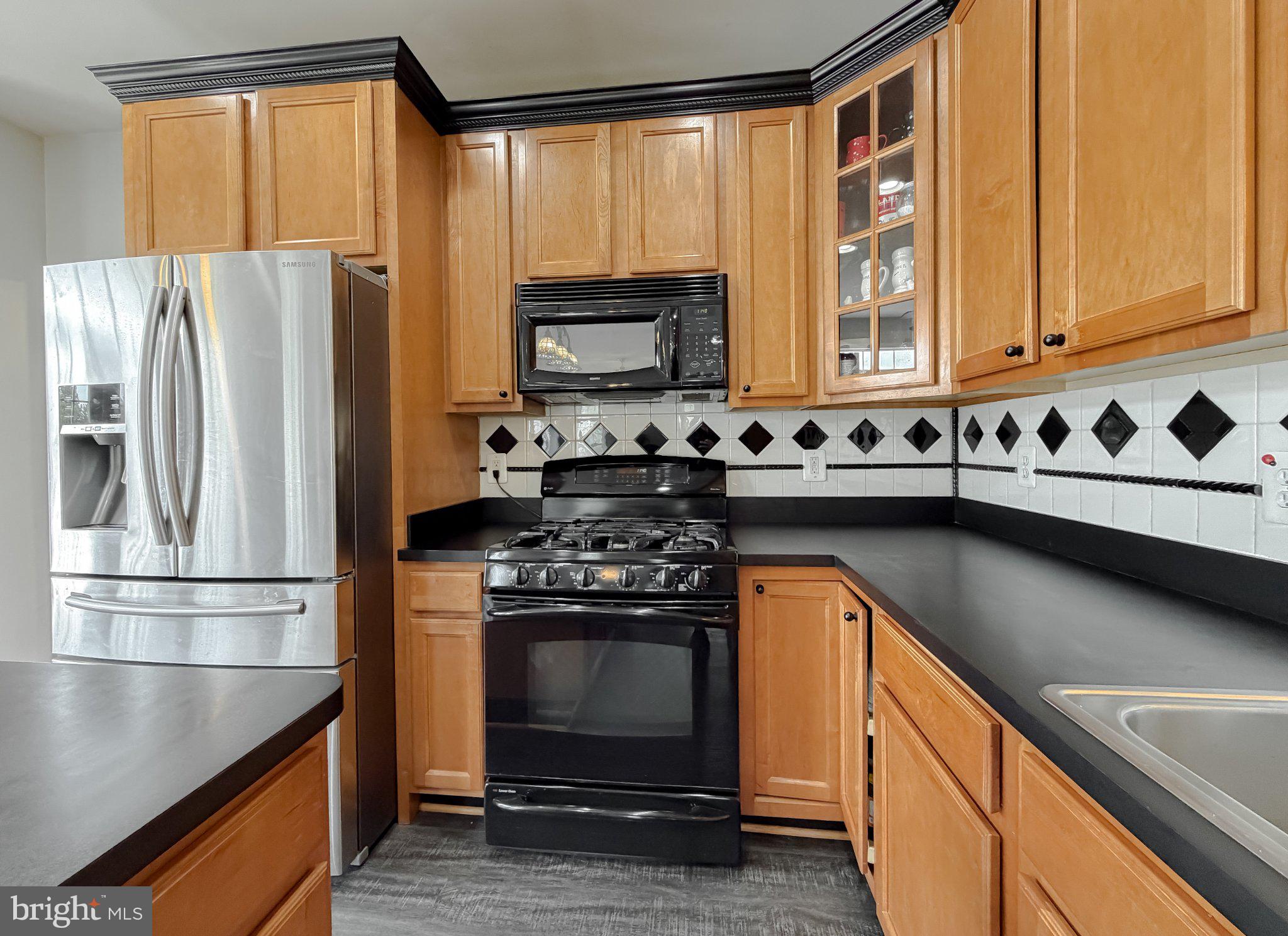 6191 Hallowing Point Road Prince Frederick, MD 20678 - Photo 44 of 73 Modern kitchen with sleek finishes.