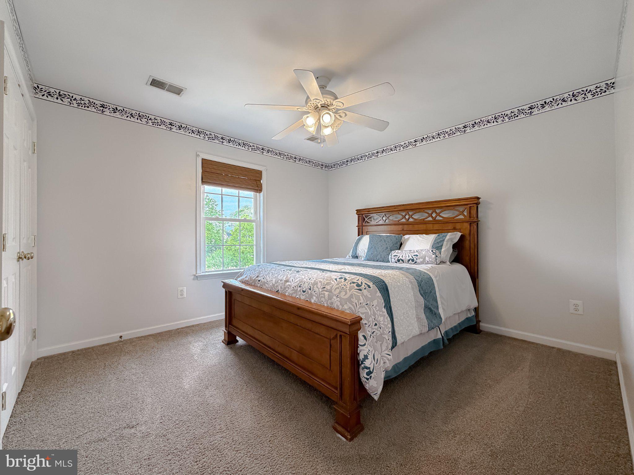 6191 Hallowing Point Road Prince Frederick, MD 20678 - Photo 52 of 73 Cozy bedroom with natural light.