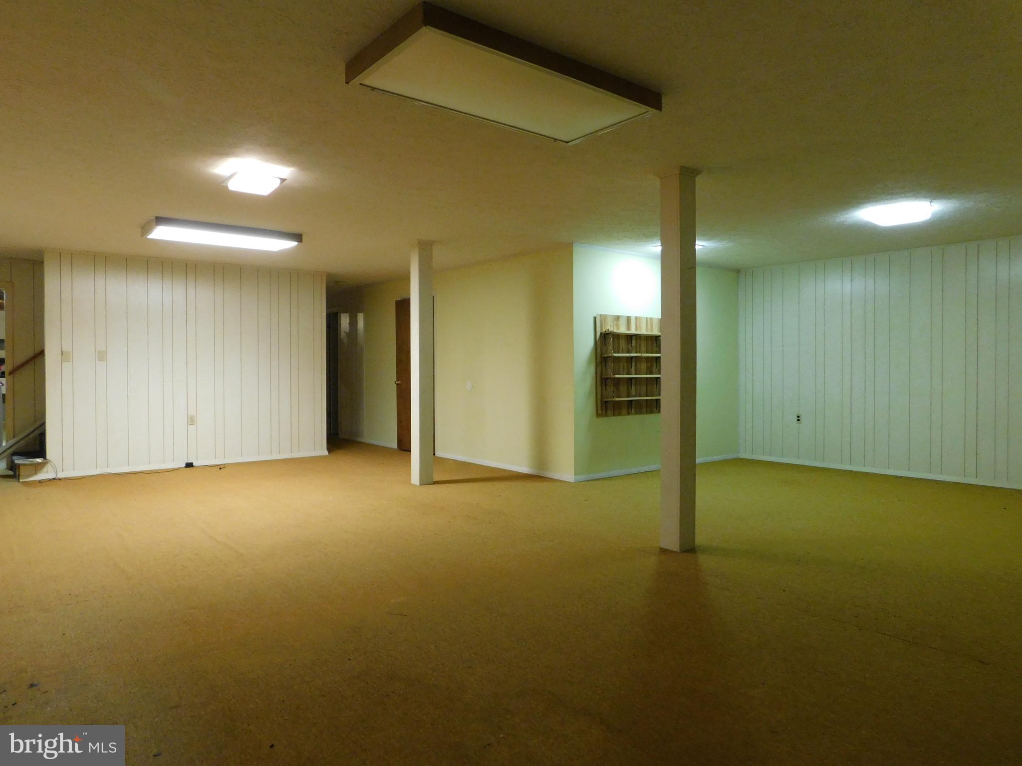 104 Tabor Road Berkeley Springs, WV 25411 - Photo 22 of 27 Basement recreation room