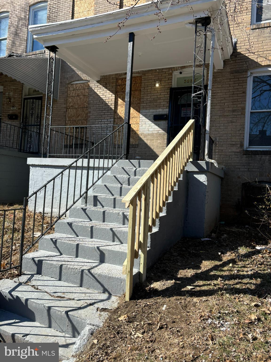 Charming entrance with inviting steps.