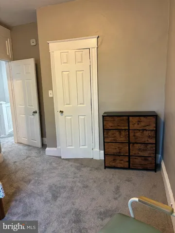 an empty room with a bench